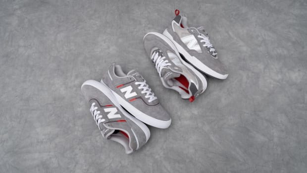 Side view of two grey New Balance shoes.